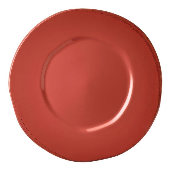 A close-up of a Libbey Farmhouse red porcelain plate with a wide rim.