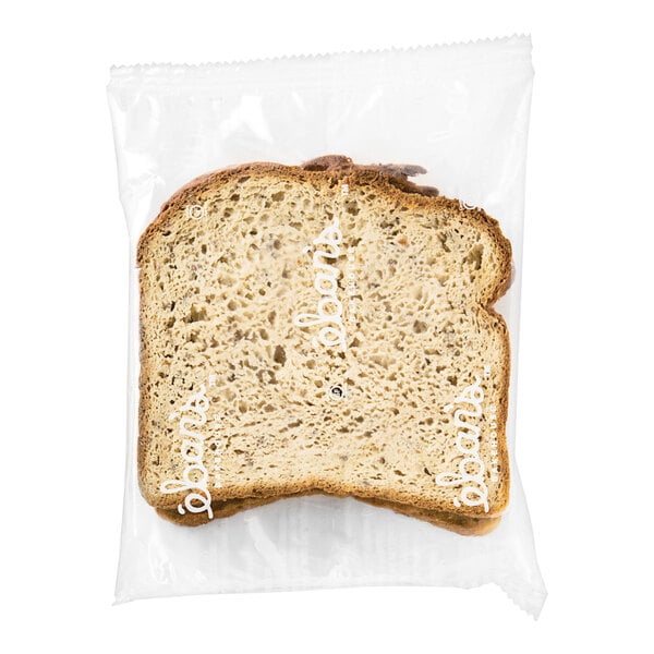 A plastic bag containing two slices of Eban's Bakehouse Gluten-Free Sandwich Bread.
