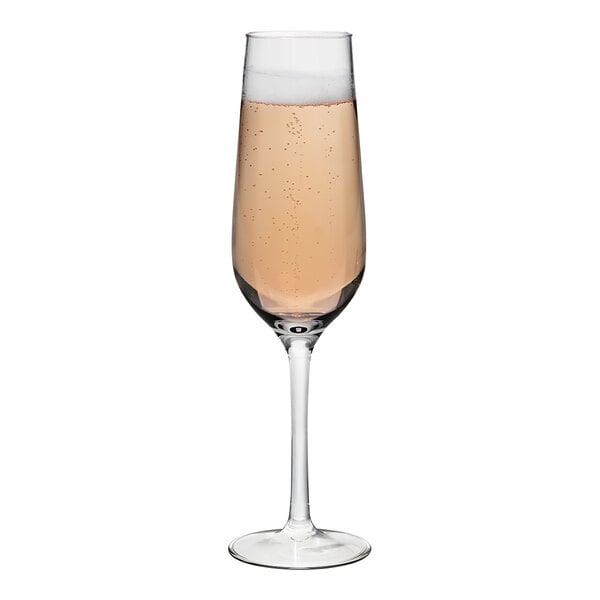 A Tossware Reserve Go-To plastic flute with pink champagne.