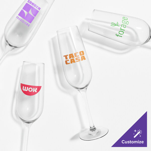 A group of Tossware Reserve wine glasses with different logos.