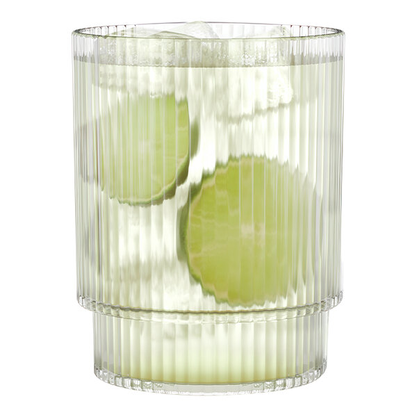 A Tossware plastic fluted tumbler with lime slices in it.