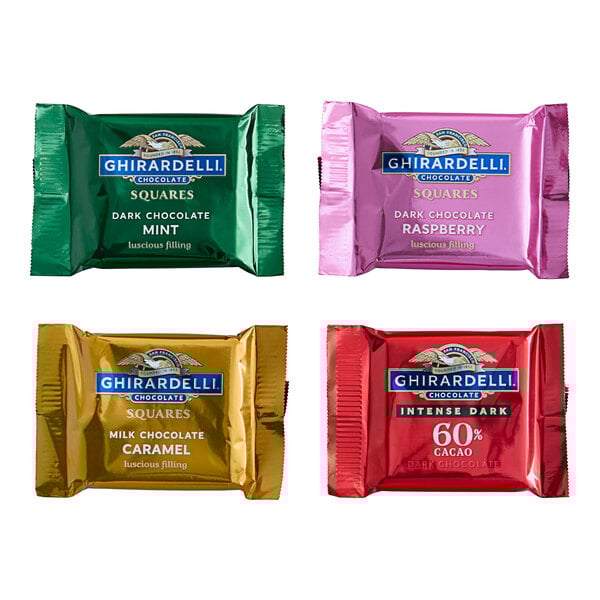 A group of Ghirardelli individually wrapped premium chocolates in various colors.