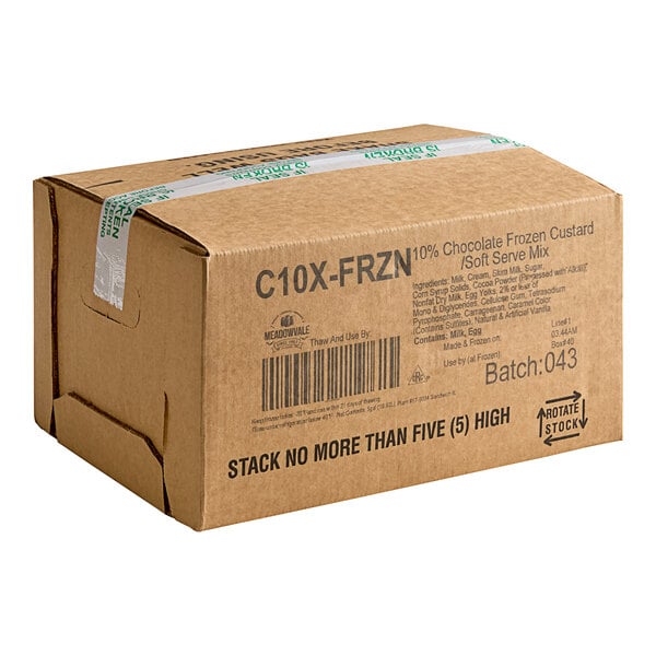 A brown box of Meadowvale C10X Chocolate Soft Serve Ice Cream Mix with black text and white tape.