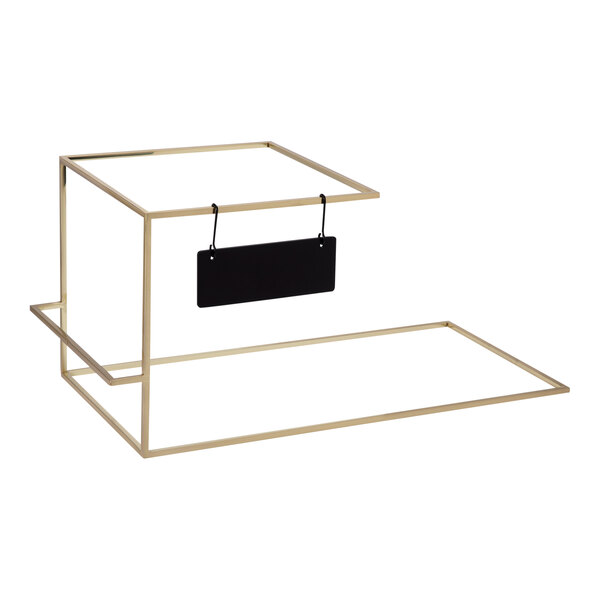 A gold metal Rosseto SkyRize trio display stand with a black hanging sign.
