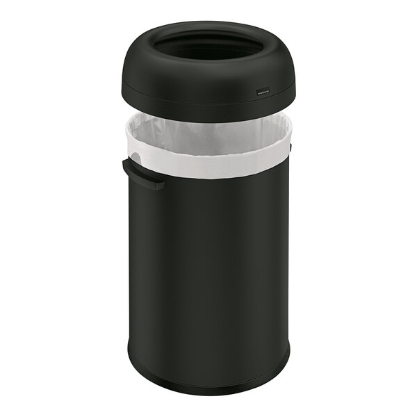 A matte black simplehuman round open top trash can with a lid.
