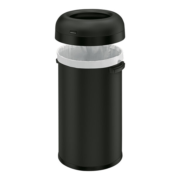 A simplehuman matte black steel round open top trash can with a plastic bag inside.