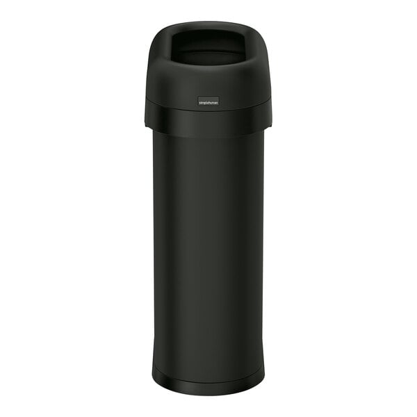 A simplehuman matte black steel trash can with an open top.