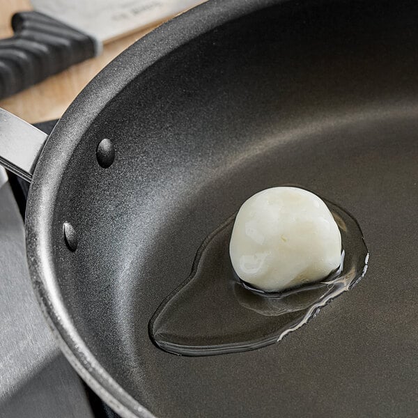 A frying pan with a piece of South Chicago Packing Lard-fried egg in it.