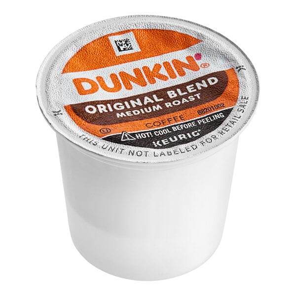 A white Dunkin' Original Blend Coffee K-Cup Pod container with an orange and white label.