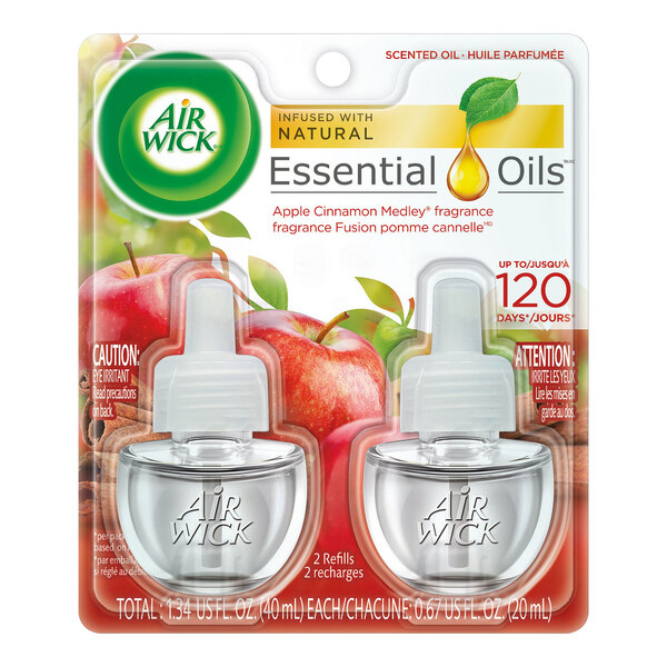 A package of twelve white Air Wick Apple Cinnamon scented oil refills with green labels.