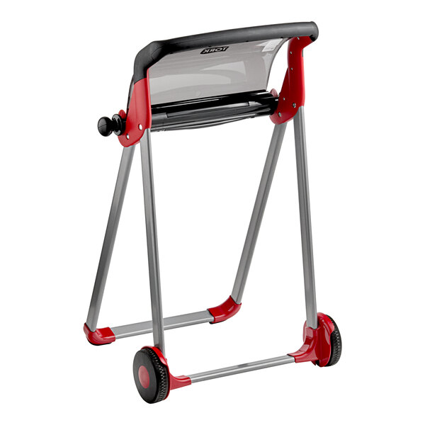 A red and black rolling cart with a Tork Performance W1 portable floor stand for wiper rolls.