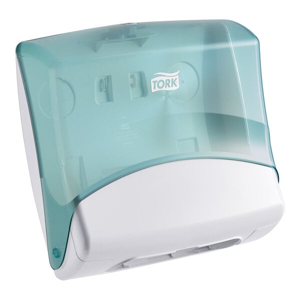 A white and blue plastic Tork folded wiper dispenser.