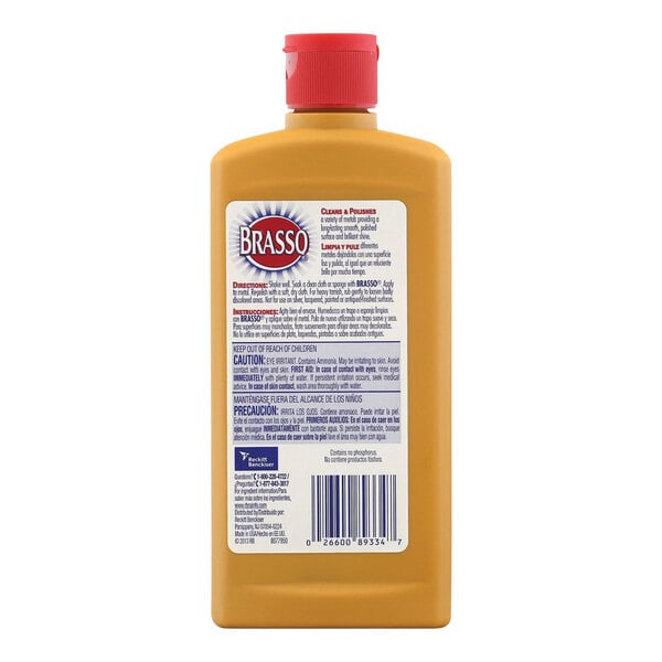 A bottle of Brasso metal polish with a red label and cap.