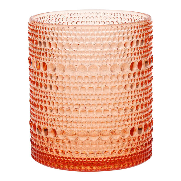 A close-up of a Fortessa Coral Blush plastic tumbler with a patterned design in orange.