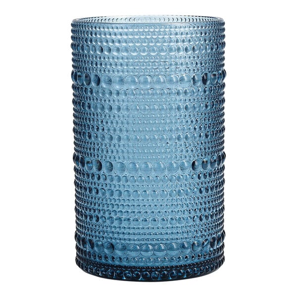 A close-up of a Fortessa Orbetto cornflower blue plastic highball glass with bubbles.