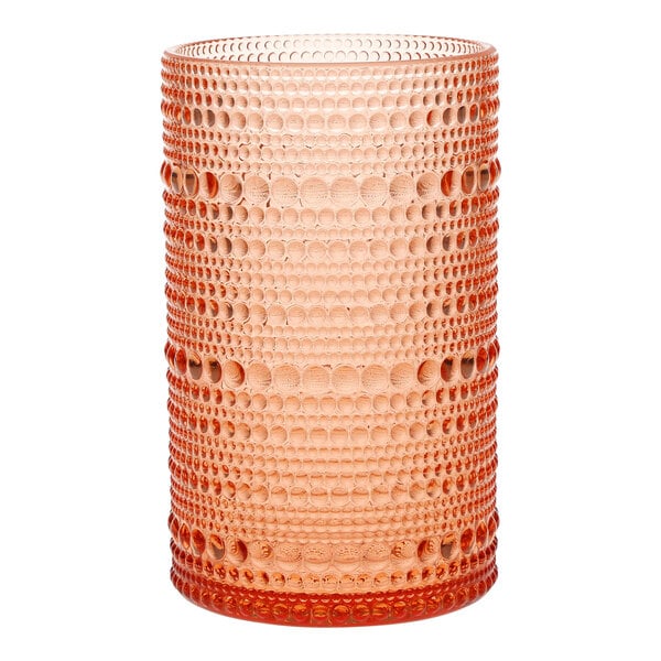 A Fortessa Coral Blush plastic highball glass with a patterned design.