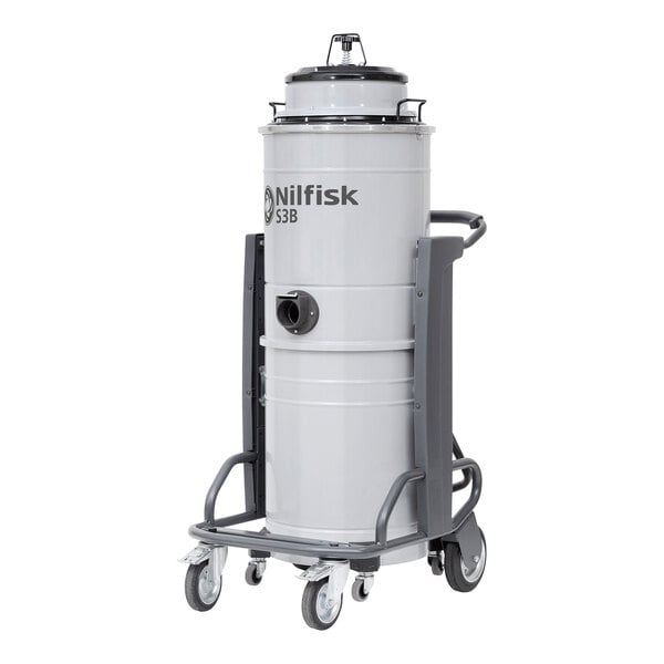 A white Nilfisk steel wet/dry vacuum cylinder with black wheels and handle.