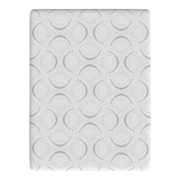 A close-up of a white surface with a blue circle pattern on a Rize Home Cool Plus memory foam mattress.