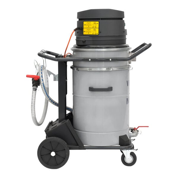A grey Nilfisk wet dry vac on a cart with a hose attached.