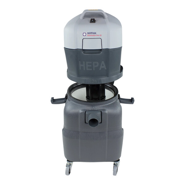 A white and grey Nilfisk Eliminator Pro II wet/dry vacuum with wheels and a handle.