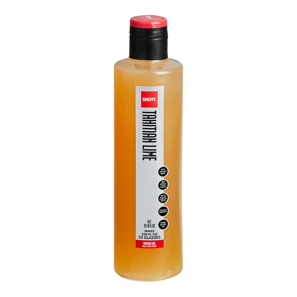 A close up of a bottle of SHOTT Tahitian Lime syrup with a red lid.