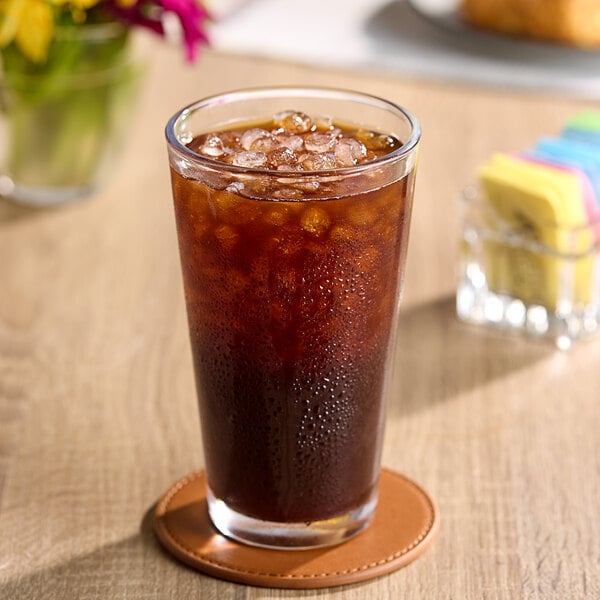 A glass of Wandering Bear cold brew coffee with ice on a table