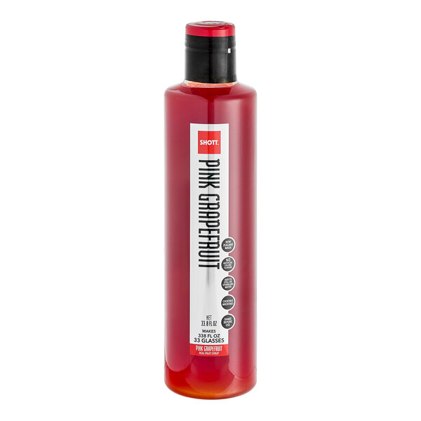A bottle of red SHOTT Pink Grapefruit flavoring syrup with a red cap.