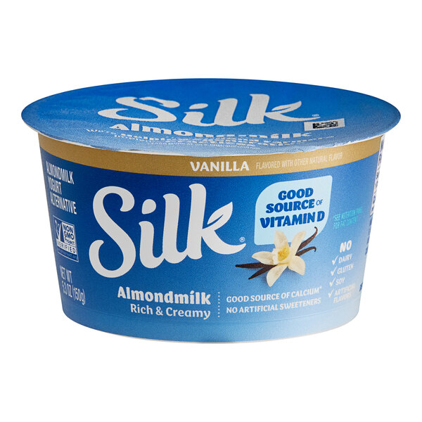 A blue round container of Silk Dairy-Free Vanilla Almond Milk Yogurt Alternative with a blue and white label.
