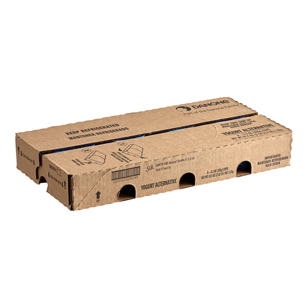 A brown cardboard box with three holes.