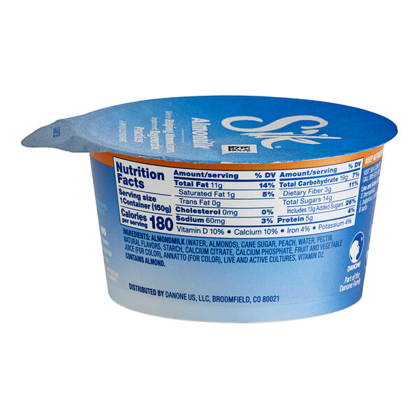 A Silk Dairy-Free Peach Almond Milk Yogurt Alternative container with a blue and white label.