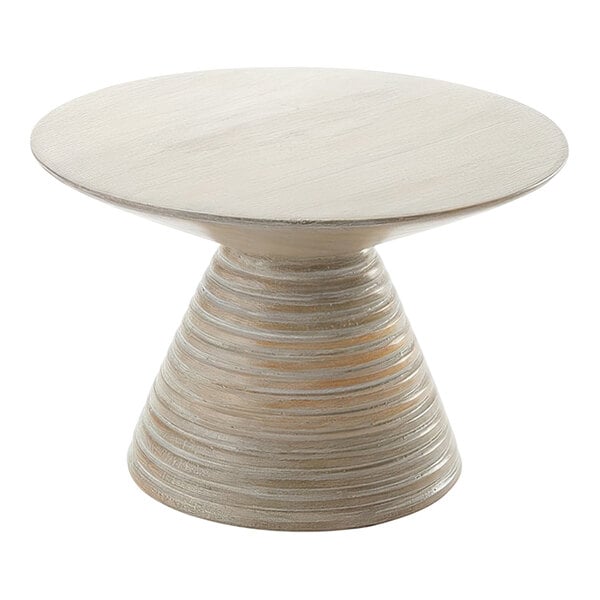 An American Metalcraft Hampton Collection round sun-bleached mango wood pedestal on a white round table.