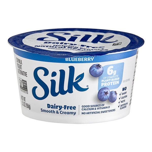 A Silk blueberry yogurt alternative container with blueberries on the label.