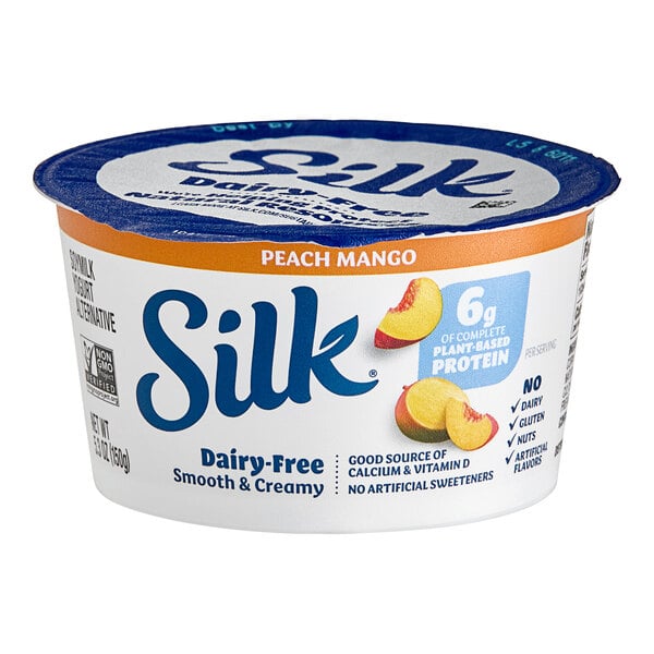 A Silk Dairy-Free peach mango yogurt alternative container.