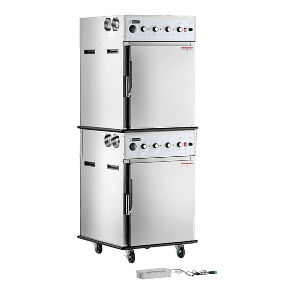 A stacked stainless steel cook and hold smoker oven with control knobs, handles, and a separate smoker box on the floor.