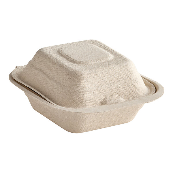 A white Dart ProPlanet compostable fiber hinged take-out container.