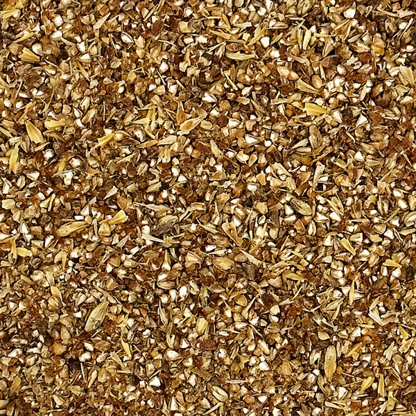 A pile of crushed brown and white grains of Briess Caramel Malt.