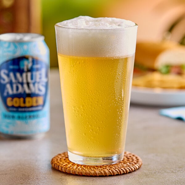 A glass of Samuel Adams Golden Non-Alcoholic Lager on a coaster.