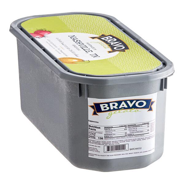 A Bravo Cappuccino Gelato tub with a lid and label in a grocery store aisle.