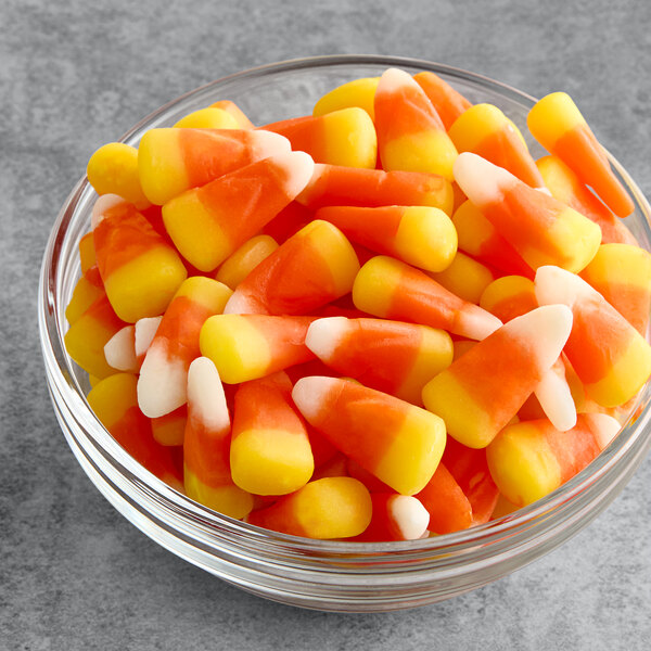 A bowl of Brach's Classic Candy Corn on a table.