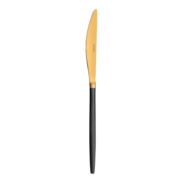 An Amefa Soprano stainless steel table knife with a black and gold handle.