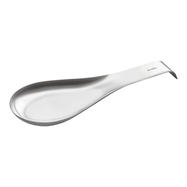 A silver spoon with a curved edge on a white background.