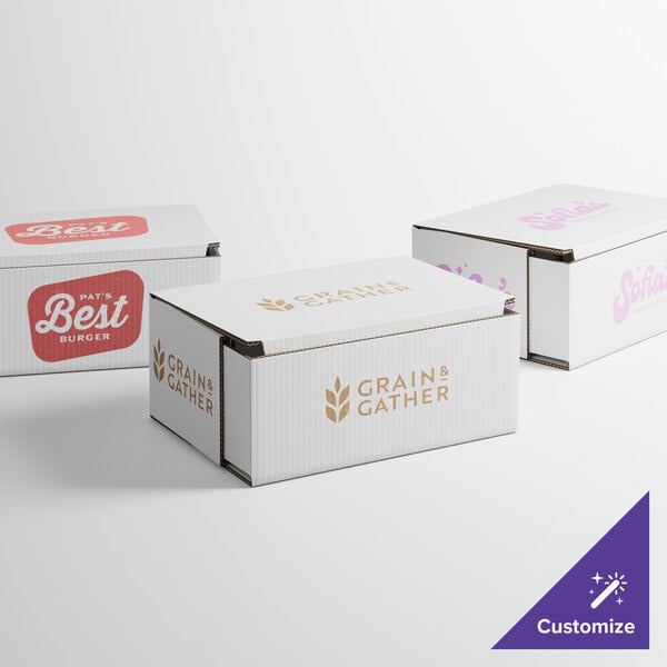 A group of Lavex white mailer boxes with different designs on them.