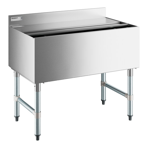 A Regency stainless steel underbar ice bin with sliding lid on a counter.