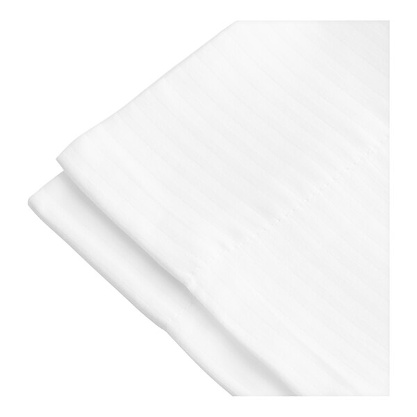 A folded white 1888 Mills Magnificence pillowcase with a tone on tone stripe.