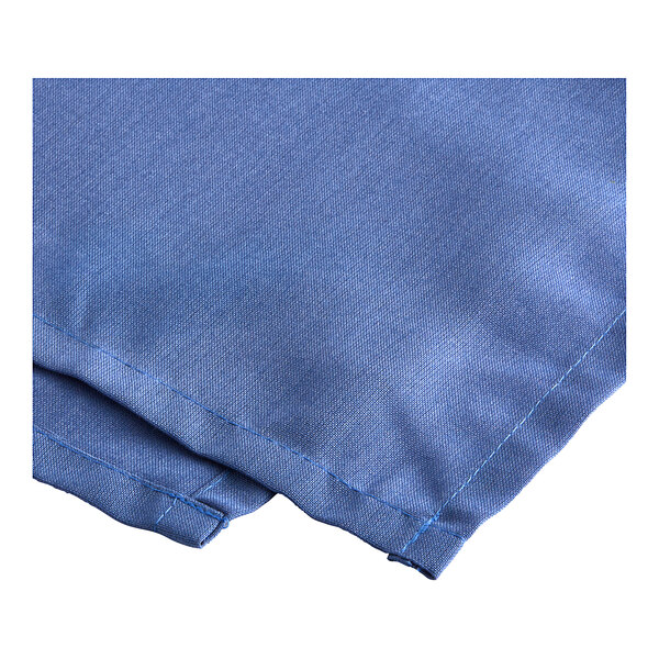 A blue polyester bed skirt with blue stitching along the edge.