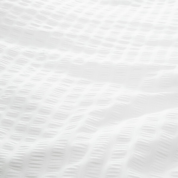 A 1888 Mills white polyester top sheet with a grid pattern.