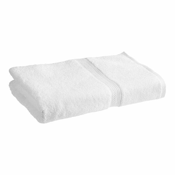 A close-up of a white 1888 Mills Magnificence bath towel.