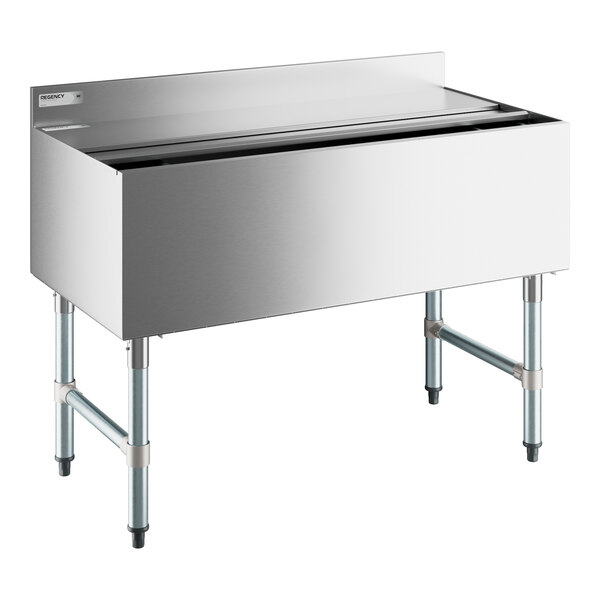 A Regency stainless steel underbar ice bin with sliding metal lid.