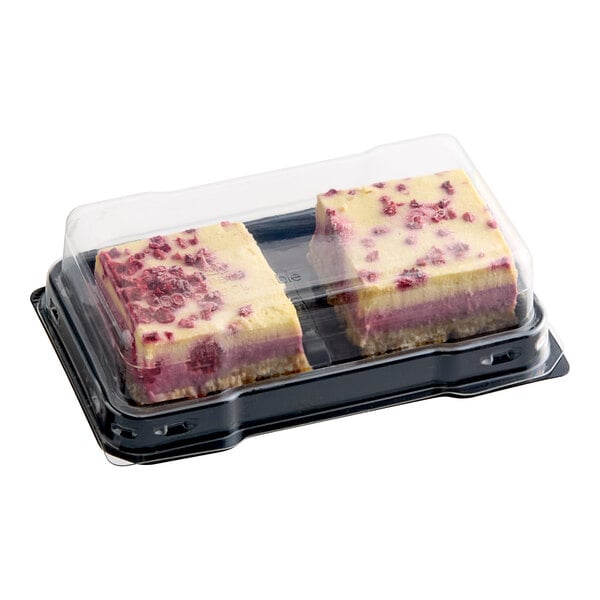 Two Nats Rawline plant-based passion fruit and raspberry cake squares in plastic containers.
