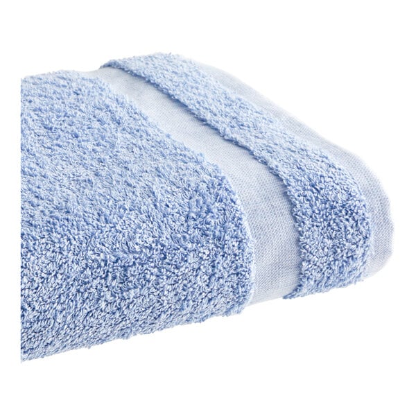 A white towel with a blue stripe.